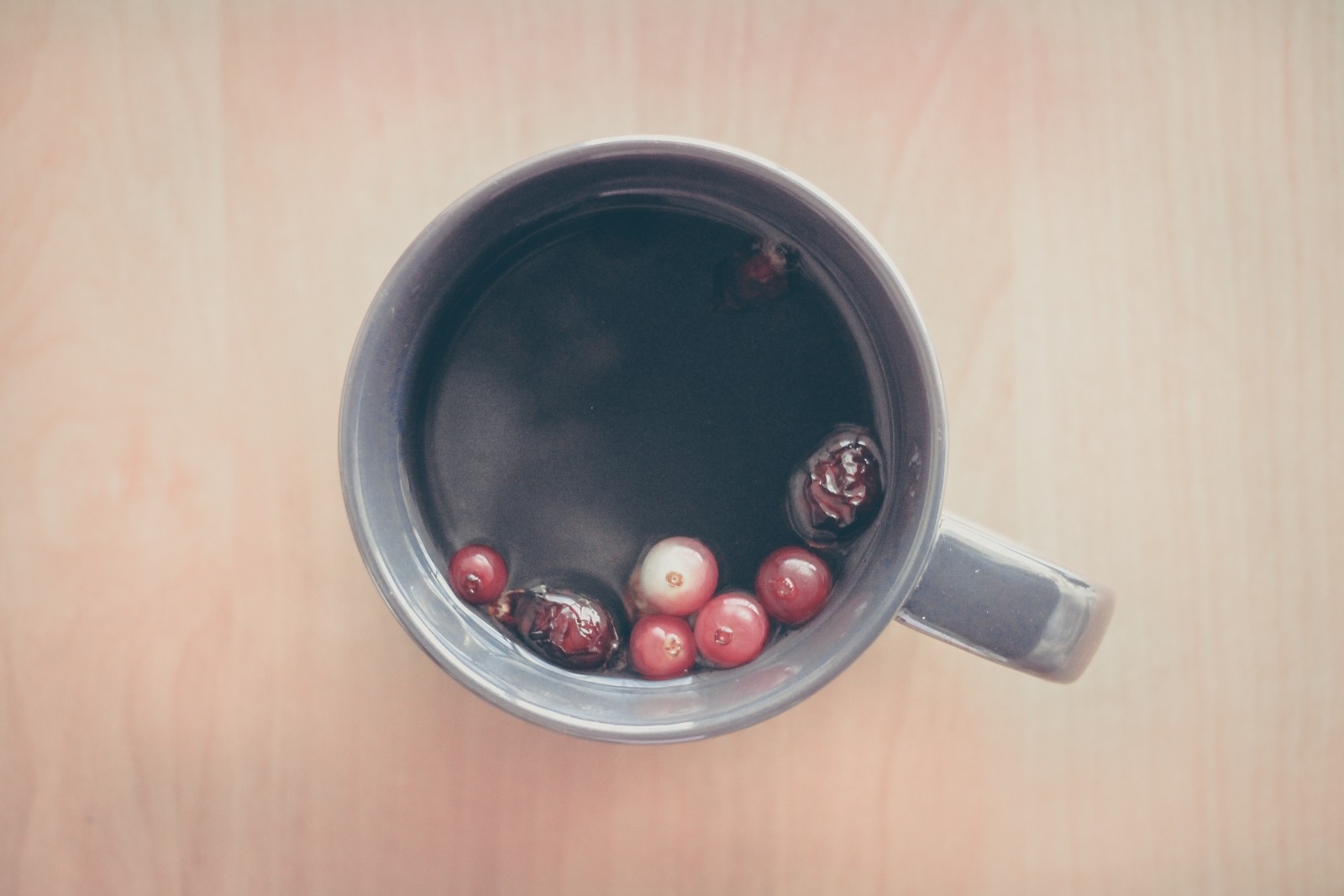 Cup of tea with berries